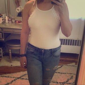 White bodysuit with lace trim and open back. NWT